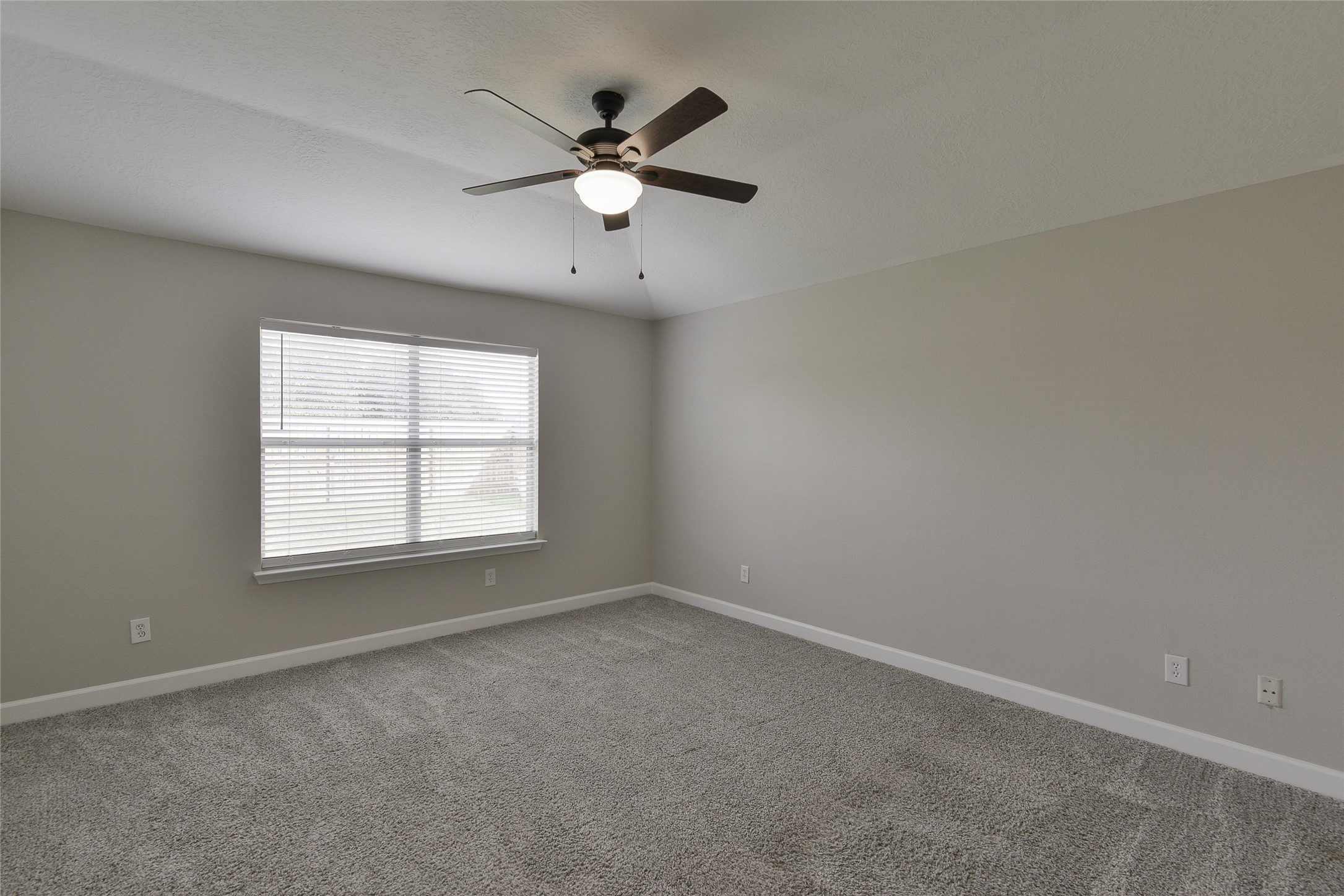 13027 Lark Point Court Houston, TX 77044 - Photo 23 of 29 an empty room with a window and a fan