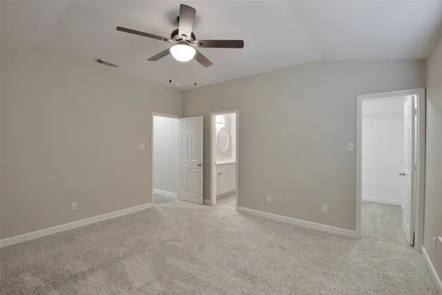 a view of a bathroom from a hallway