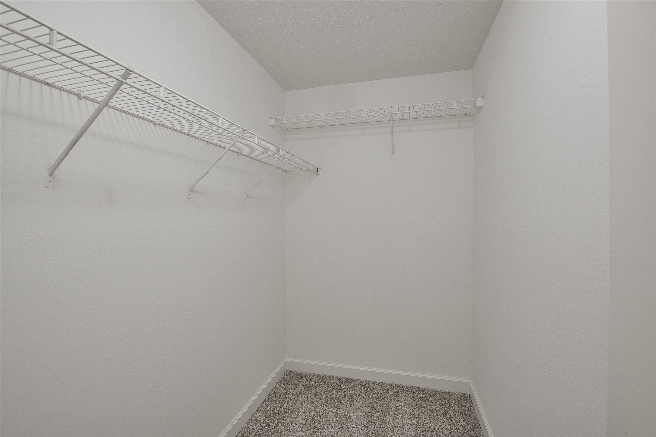 13027 Lark Point Court Houston, TX 77044 - Photo 25 of 29 a view of a room with racks on the wall
