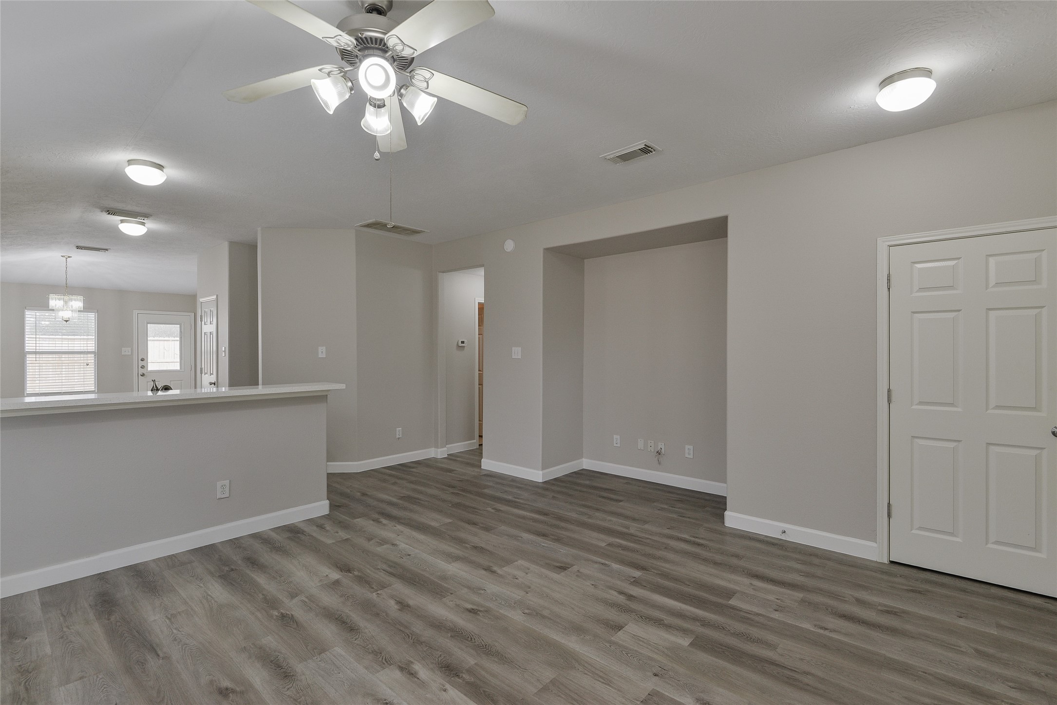 13027 Lark Point Court Houston, TX 77044 - Photo 6 of 29 wooden floor in an empty room with a window