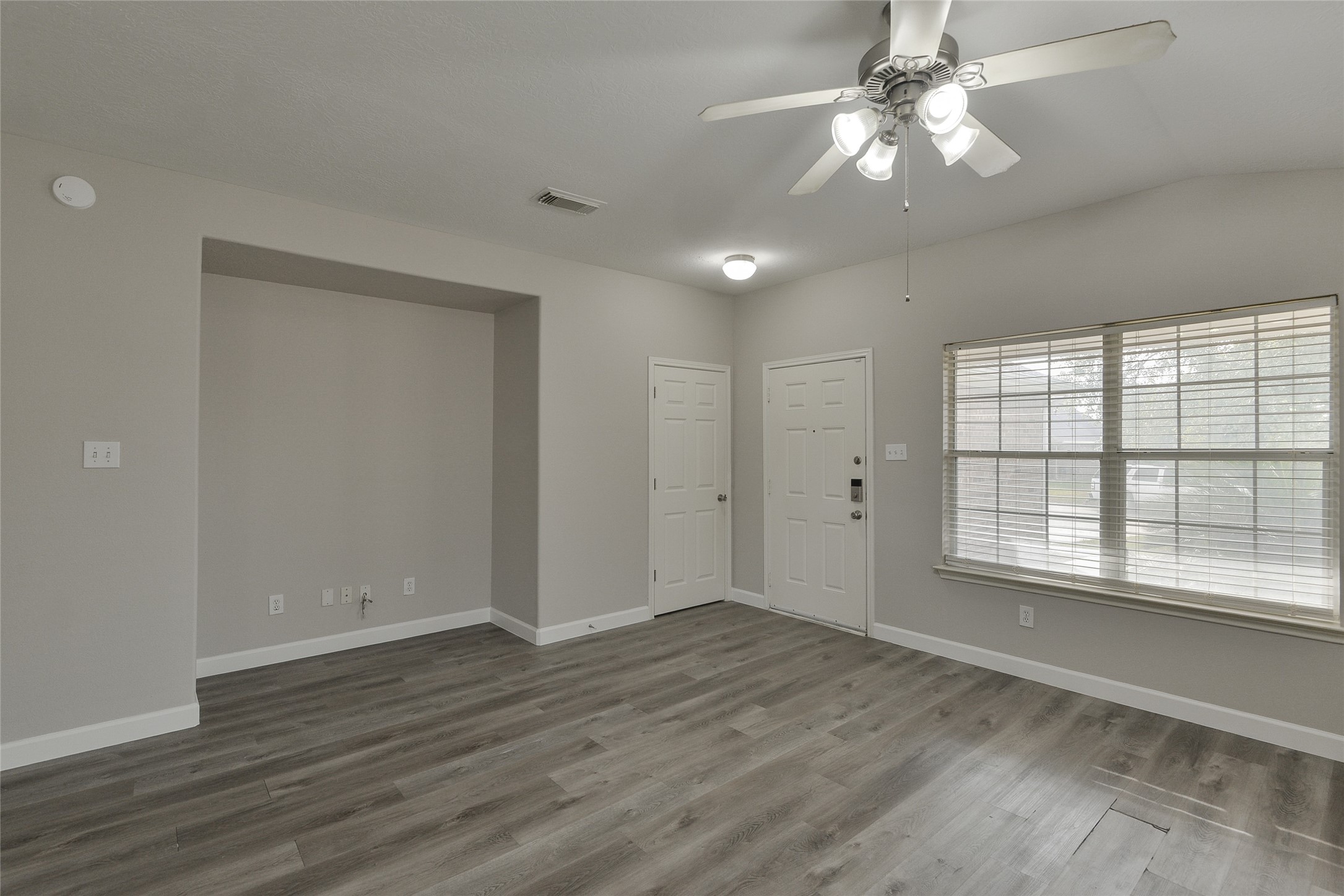 13027 Lark Point Court Houston, TX 77044 - Photo 7 of 29 wooden floor in an empty room with a window