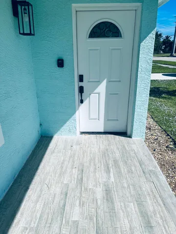 a view of outdoor space and wooden floor