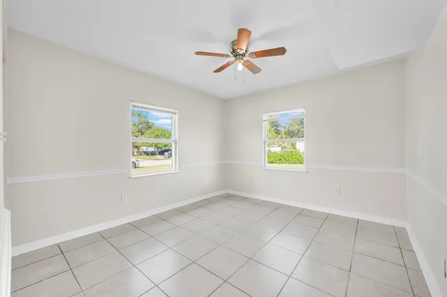 a bathroom with a granite countertop sink a toilet and bathtub