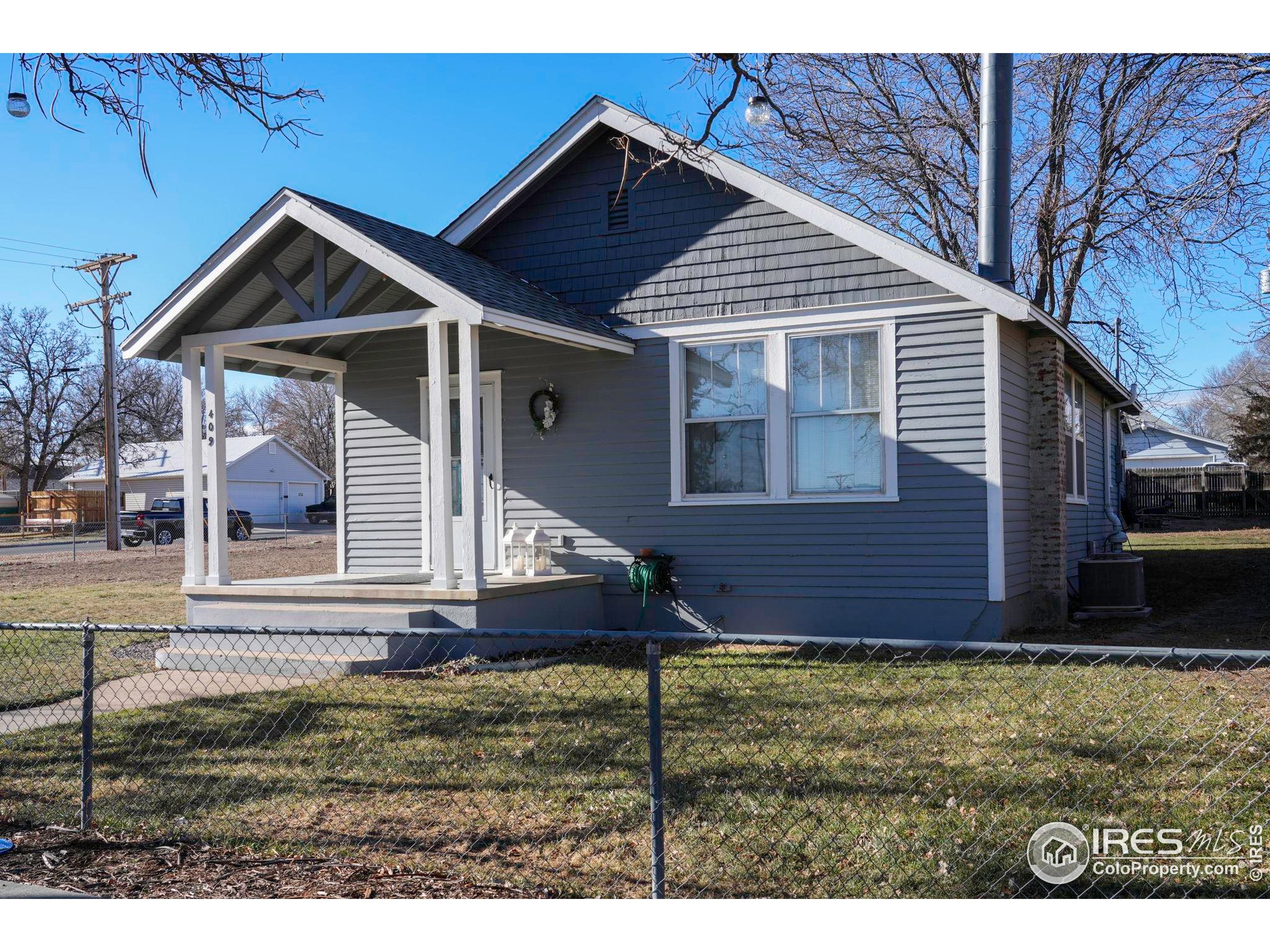 409 Main Street Mead, CO 80542 - Photo 2 of 35 a view of house with yard