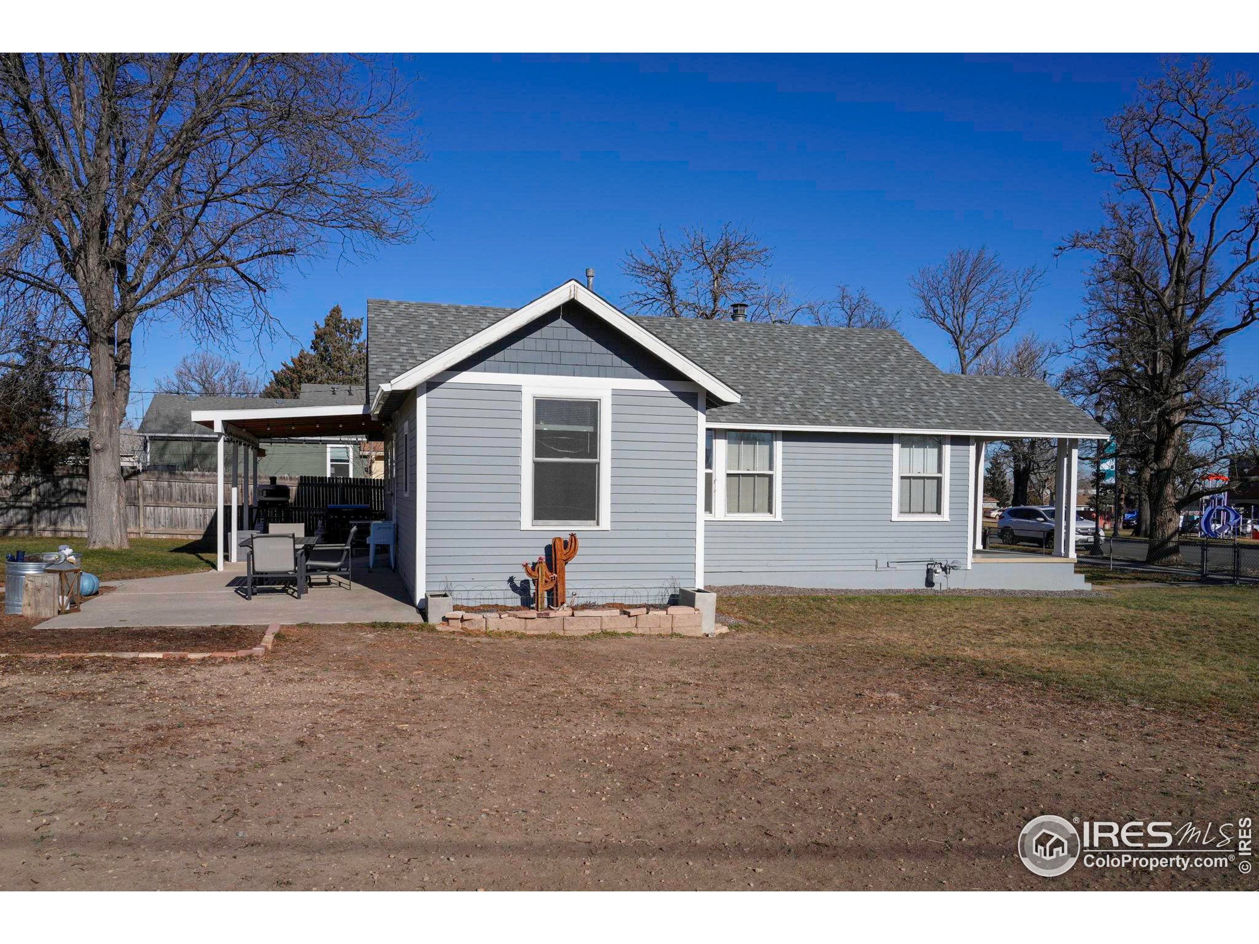 409 Main Street Mead, CO 80542 - Photo 21 of 35 a front view of a house with a garden