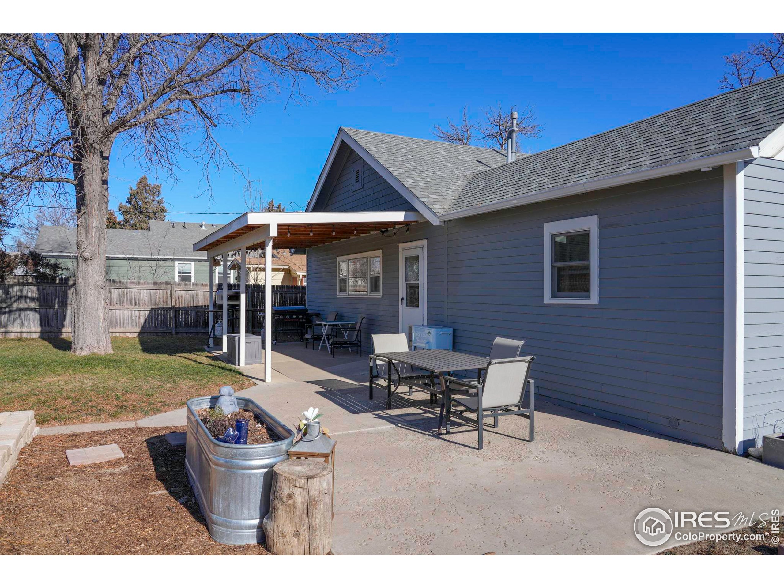 409 Main Street Mead, CO 80542 - Photo 23 of 35 a patio with table and chairs