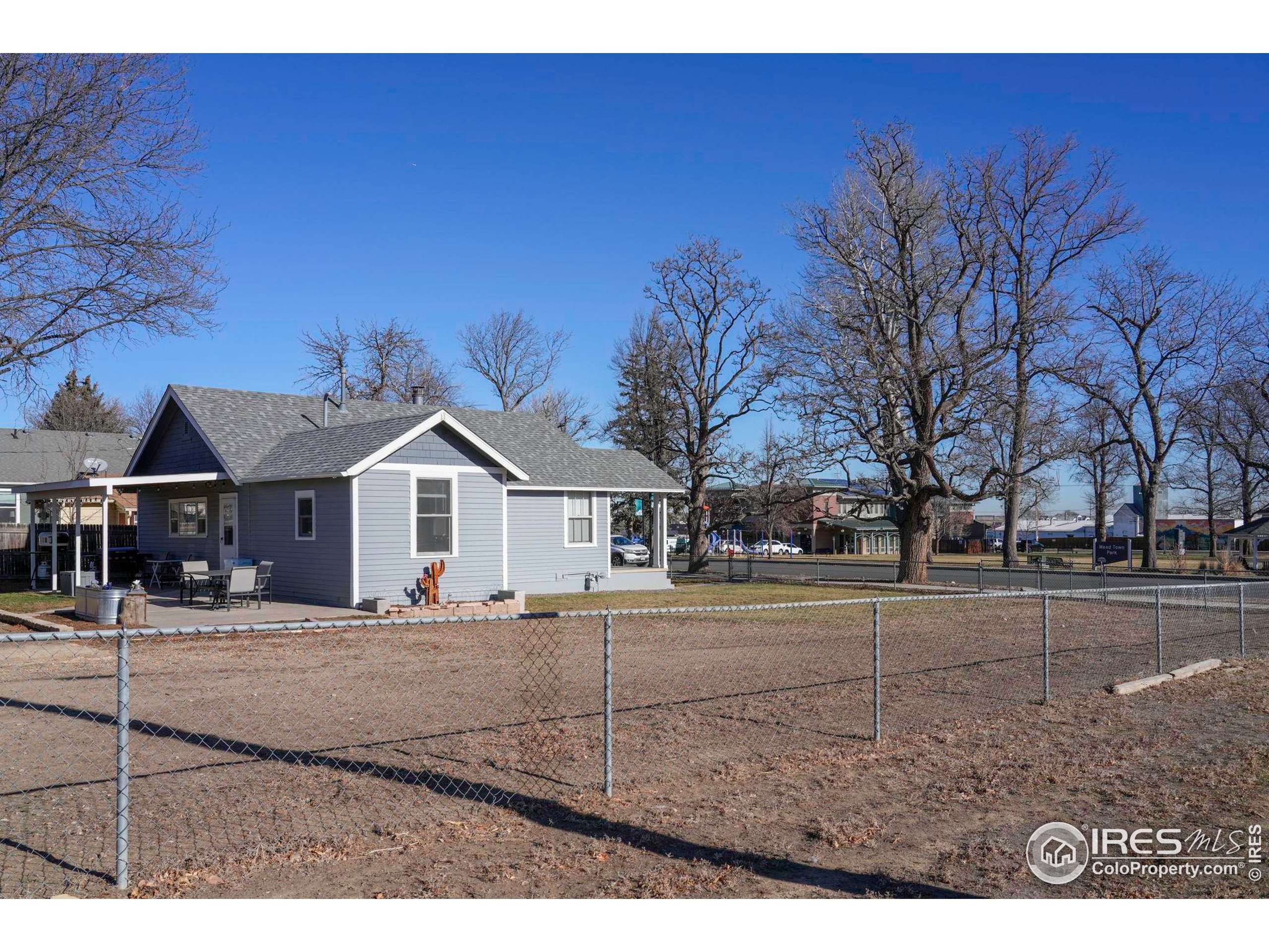 409 Main Street Mead, CO 80542 - Photo 26 of 35 a view of a yard in front of a brick building