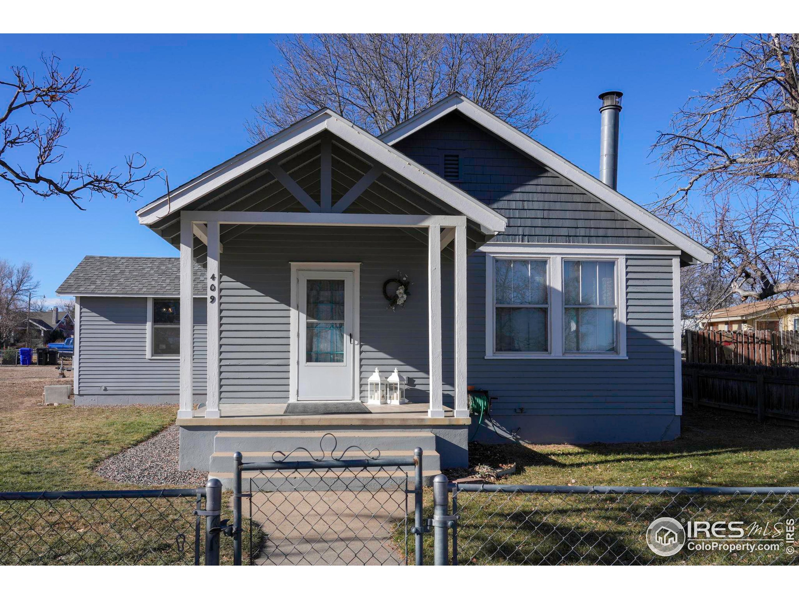 409 Main Street Mead, CO 80542 - Photo 29 of 35 a front view of a house with garden