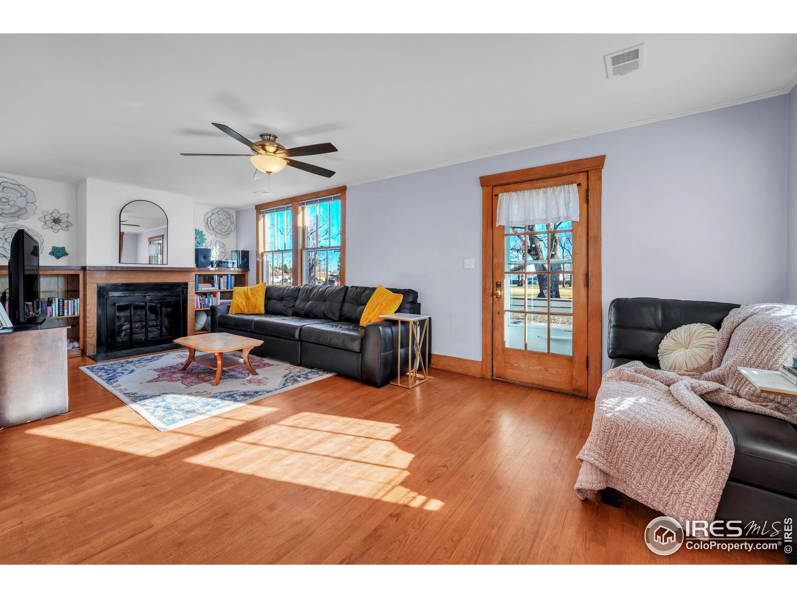 409 Main Street Mead, CO 80542 - Photo 3 of 35 a living room with furniture and a fireplace