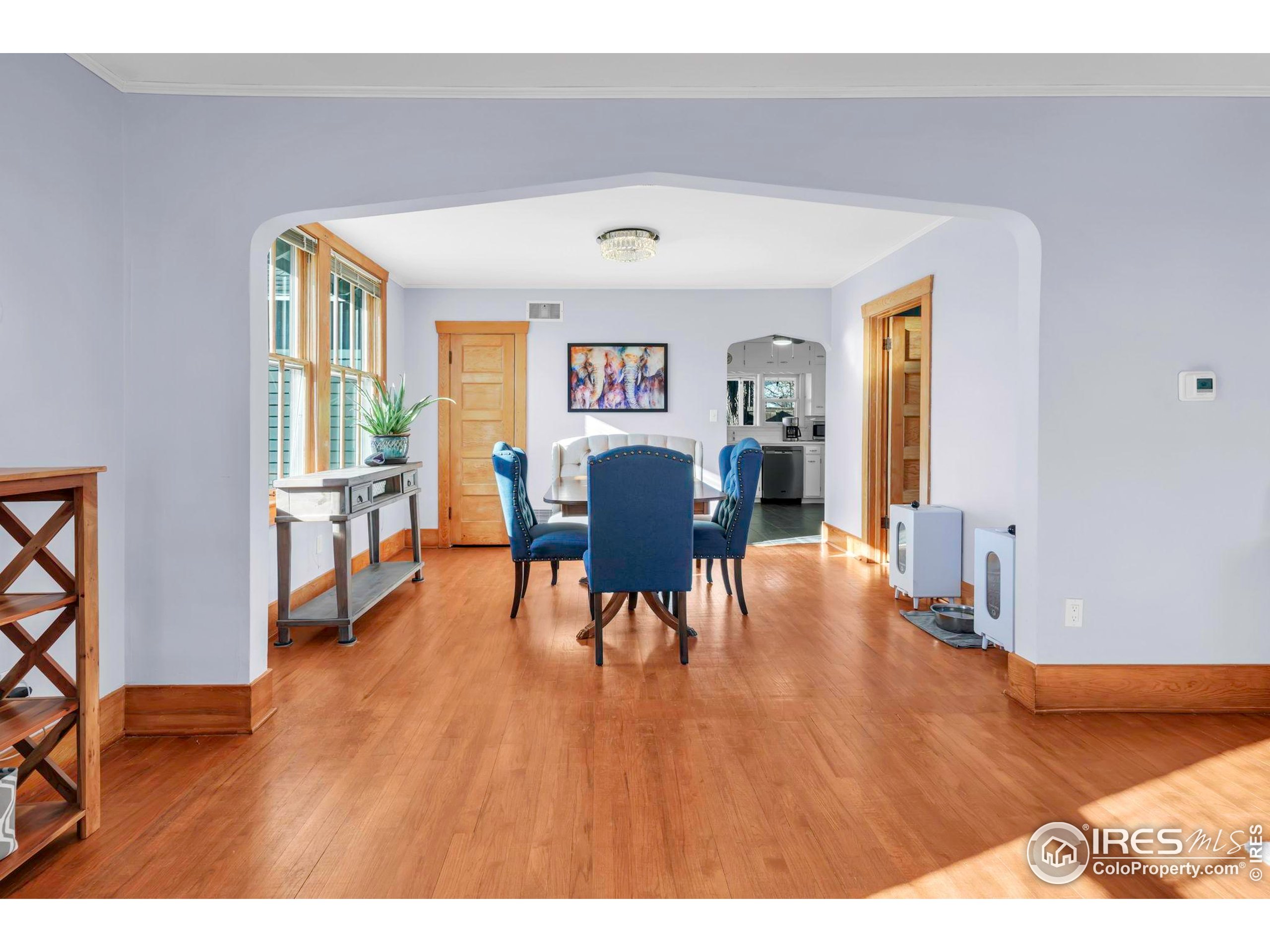 409 Main Street Mead, CO 80542 - Photo 8 of 35 a living room with furniture and a wooden floor