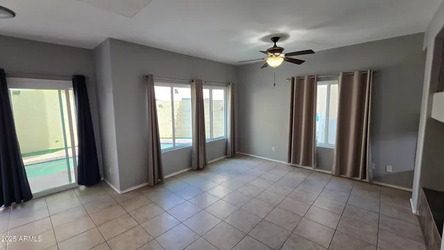 a view of an empty room with a fireplace