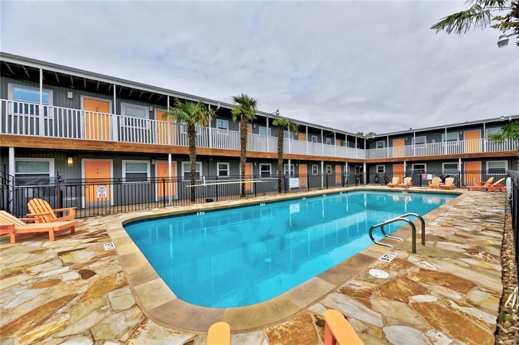 2401 Manor Road, Unit 102 Austin, TX 78722 - Photo 6 of 22 Community pool with a patio area