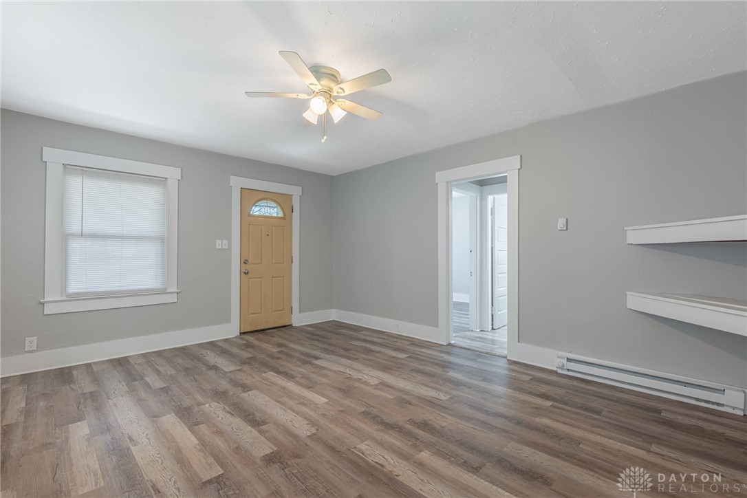 2118 Hillside Avenue Springfield, OH 45503 - Photo 4 of 28 This bright living space features durable flooring and a ceiling fan for comfort.