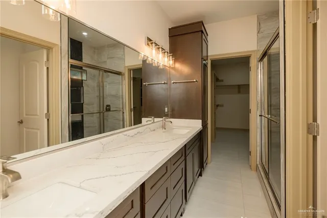 a bathroom with a sink and mirror