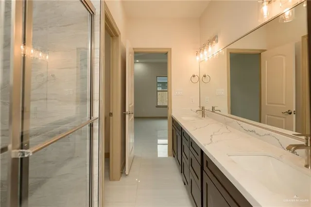 a bathroom with a bathtub sink and mirror