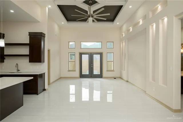 a view of a kitchen with a sink and a window