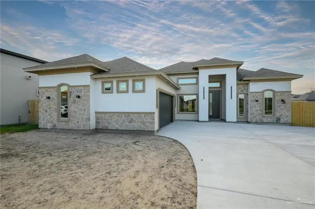 a view of a house with a tub and garage