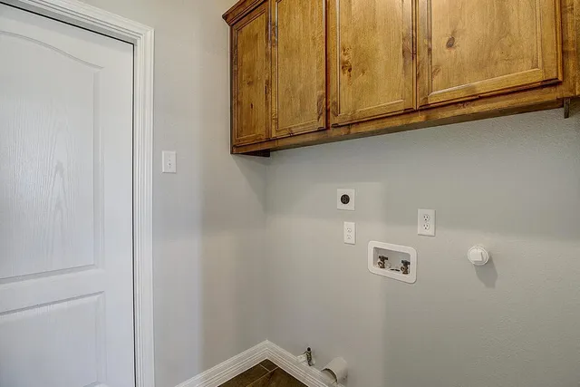 an empty room with windows and ceiling fan