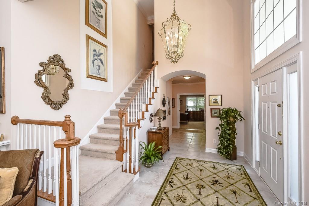 3513 Rhett Butler Place Charlotte, NC 28270 - Photo 2 of 24 a view of a hallway with wooden floor windows and entryway