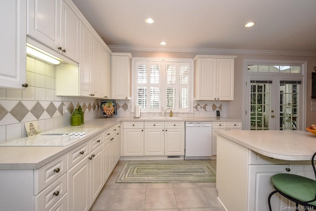 3513 Rhett Butler Place Charlotte, NC 28270 - Photo 13 of 24 a kitchen with sink cabinets and window