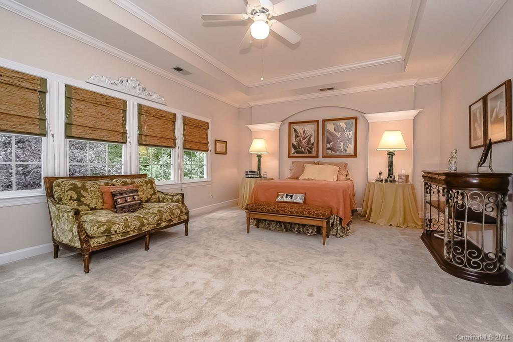 3513 Rhett Butler Place Charlotte, NC 28270 - Photo 15 of 24 a bedroom with furniture and a large window
