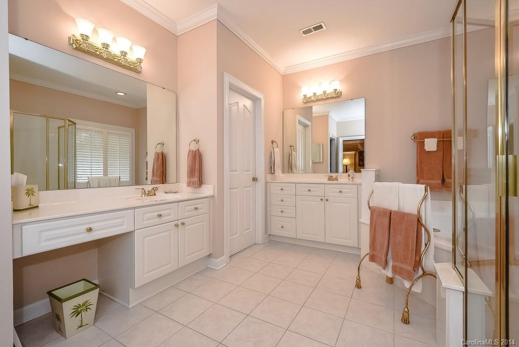 3513 Rhett Butler Place Charlotte, NC 28270 - Photo 16 of 24 a spacious bathroom with a double vanity sink and a mirror