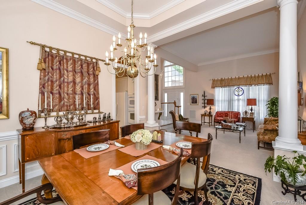 3513 Rhett Butler Place Charlotte, NC 28270 - Photo 6 of 24 a view of a dining room with furniture and chandelier