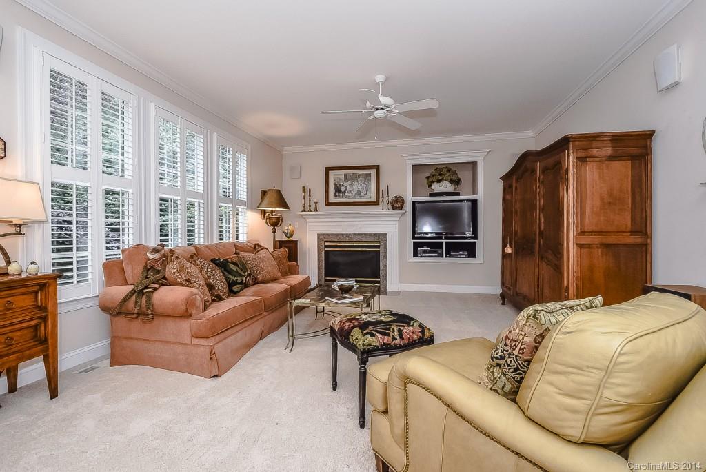 3513 Rhett Butler Place Charlotte, NC 28270 - Photo 9 of 24 a living room with furniture fireplace and a large window
