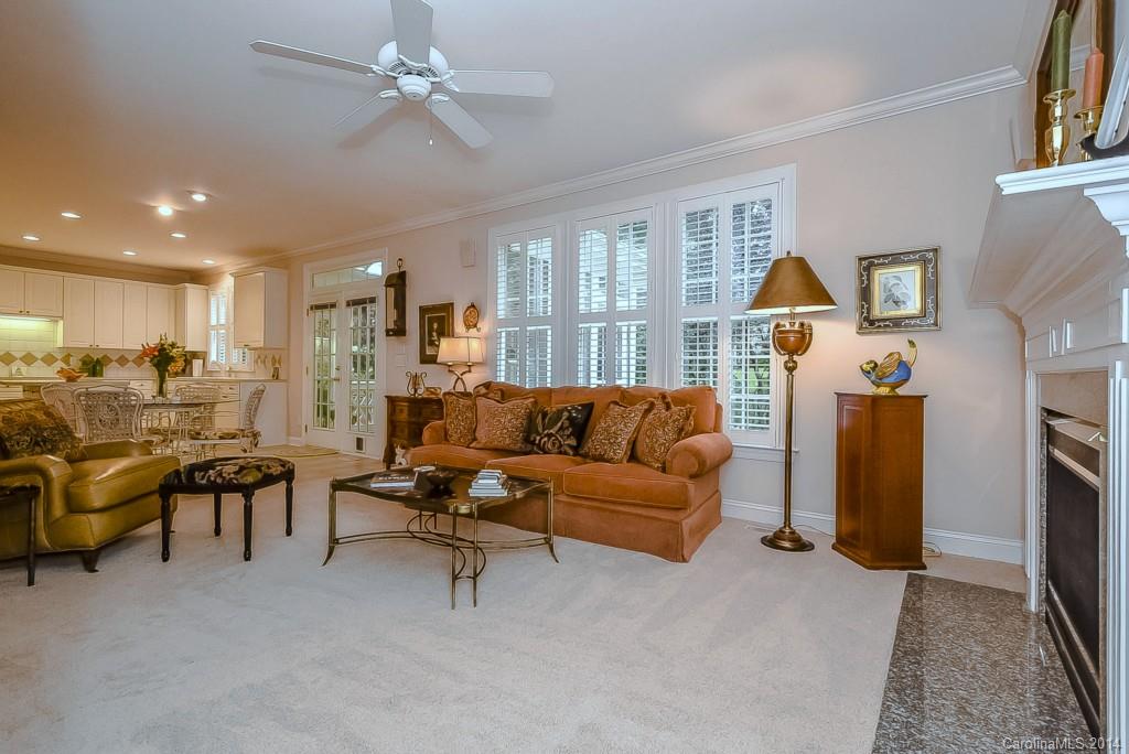 3513 Rhett Butler Place Charlotte, NC 28270 - Photo 10 of 24 a living room with furniture a ceiling fan and a window