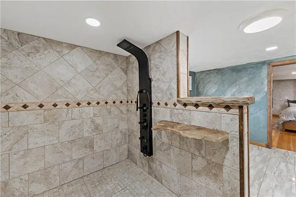 a bathroom with a toilet sink and a shower