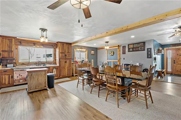 a large kitchen with a table and chairs