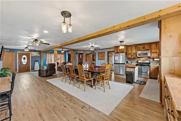 a view of a dining room with furniture and wooden floor