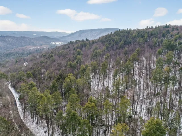 a view of a lake with mountains in the background