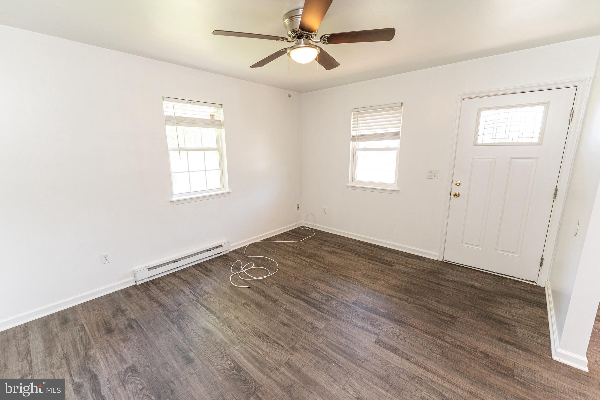 30704 Hampden Avenue Princess Anne, MD 21853 - Photo 8 of 31 a view of empty room with wooden floor and fan