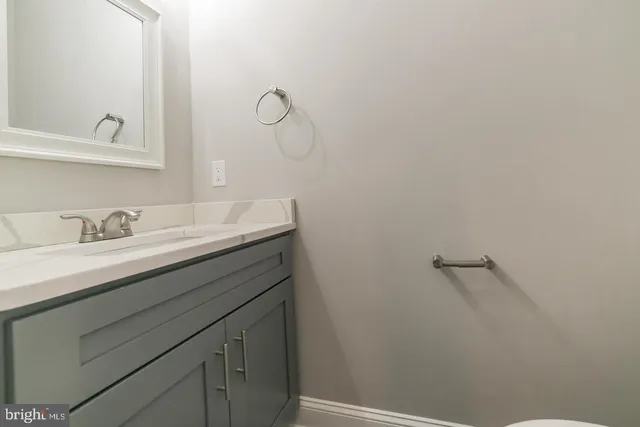 a bathroom with a sink and mirror