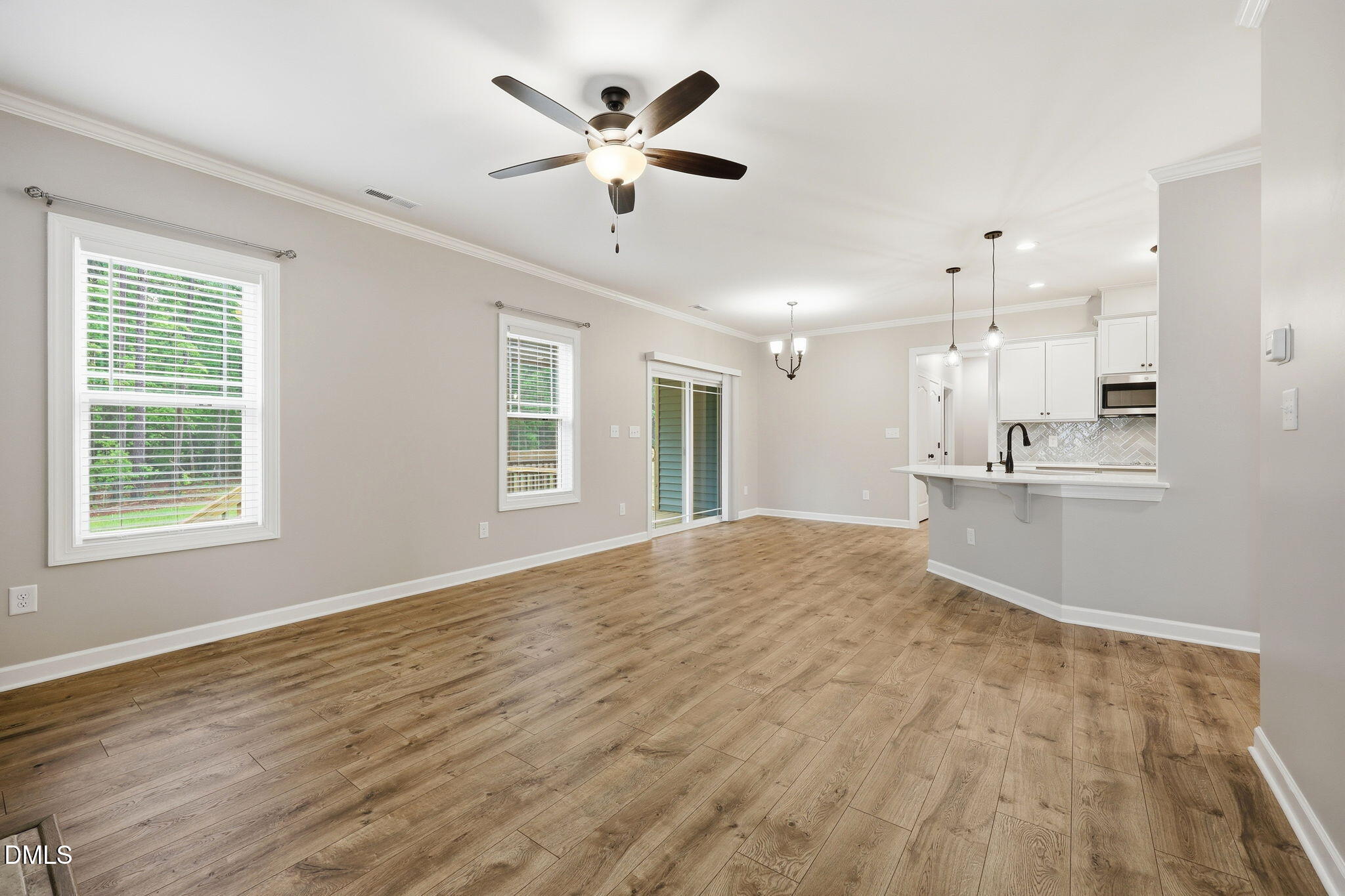 146 Seahawk Way Zebulon, NC 27597 - Photo 14 of 51 a view of an empty room with kitchen appliances and a window