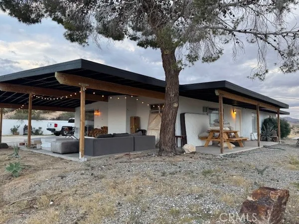 a front view of a house with patio