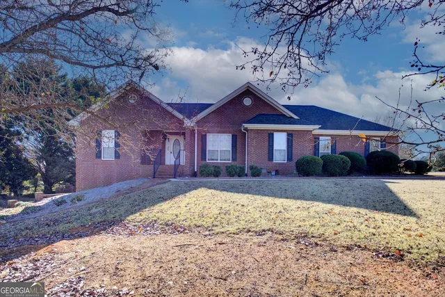 a front view of a house with a yard
