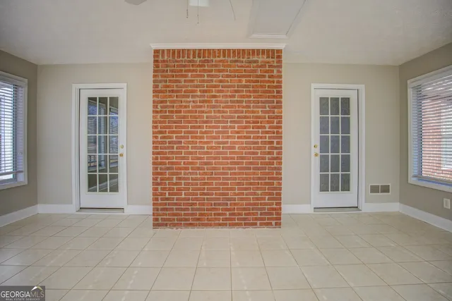 an empty room with windows