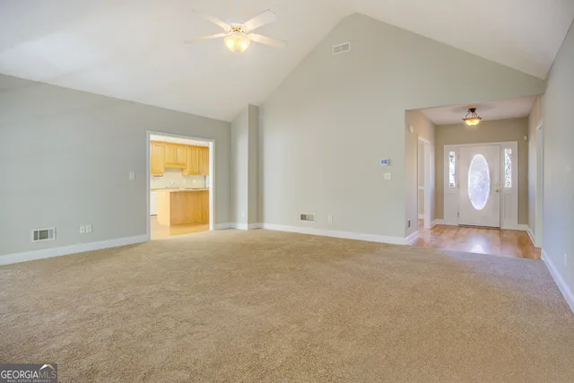 an empty room with a empty space and a window