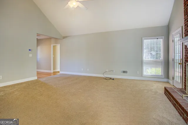 an empty room with a empty space and a window