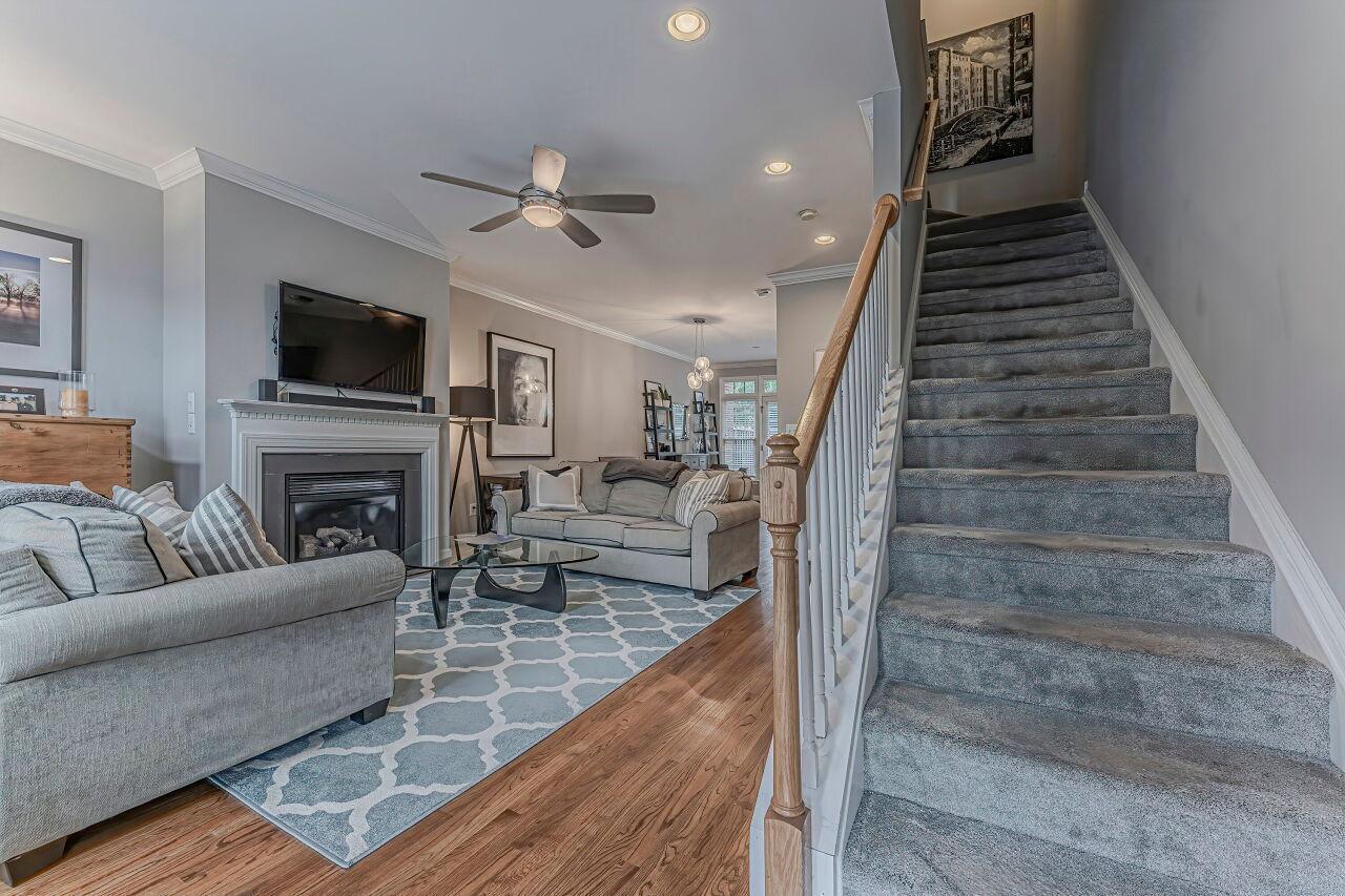 106 Hatfield Lane Raleigh, NC 27603 - Photo 5 of 29 a living room with furniture a flat screen tv and a fireplace