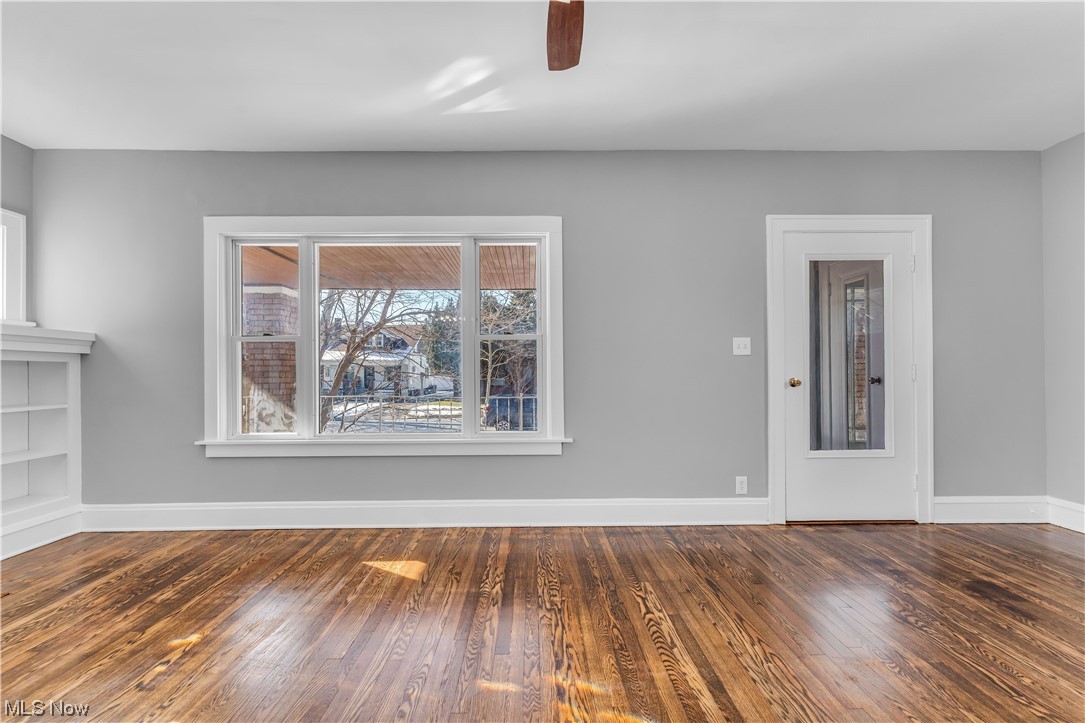 3557 Ludgate Road Cleveland, OH 44120 - Photo 6 of 32 Unfurnished room with dark hardwood / wood-style floors and ceiling fan
