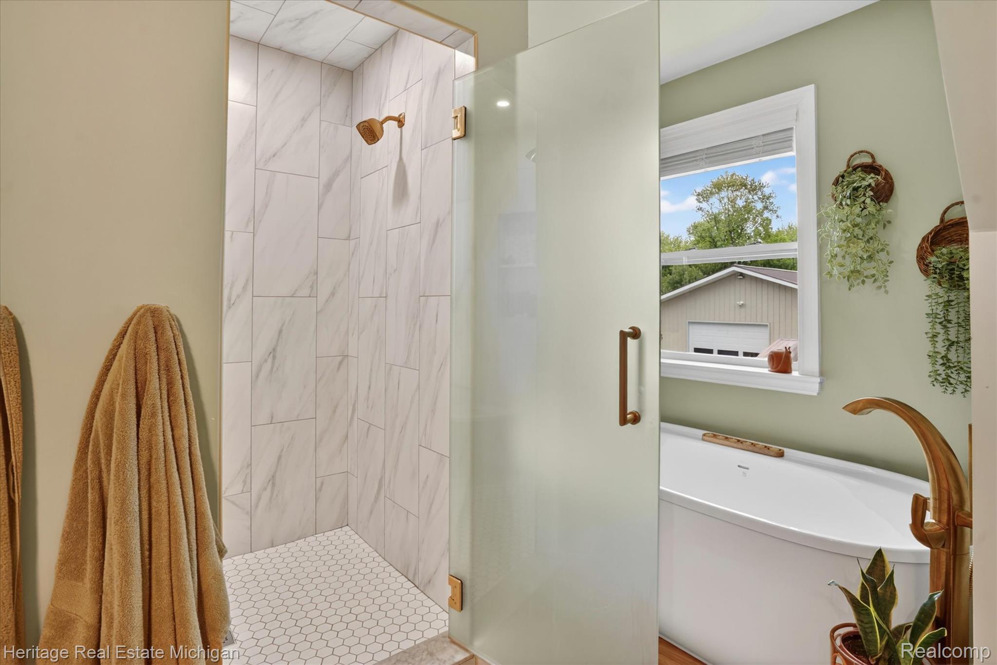 5835 Warner Road Fowlerville, MI 48836 - Photo 20 of 59 Full bathroom with a shower stall and a soaking tub