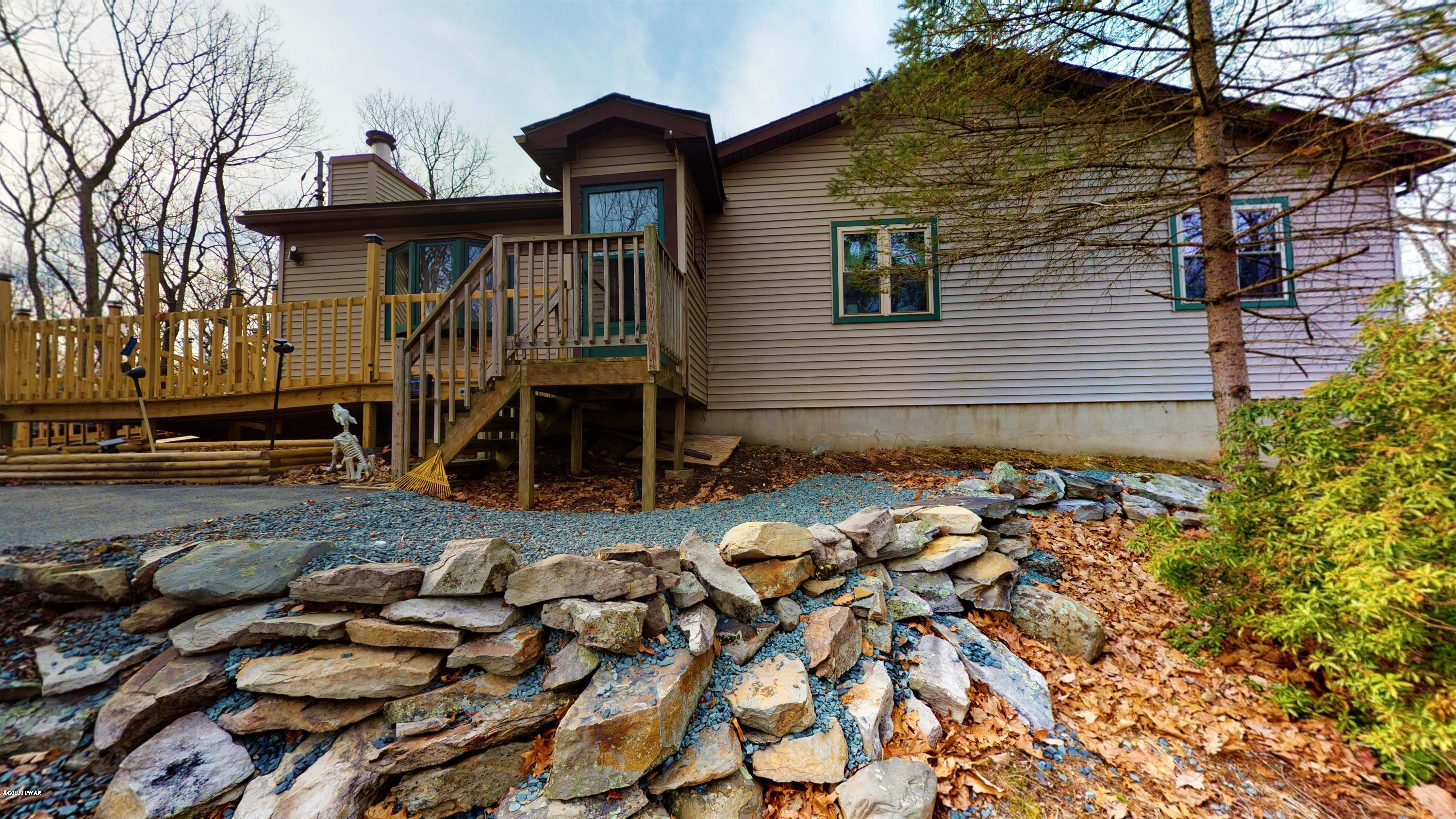 130 Maple Ridge Road Milford, PA 18337 - Photo 1 of 44 a view of a house with a yard