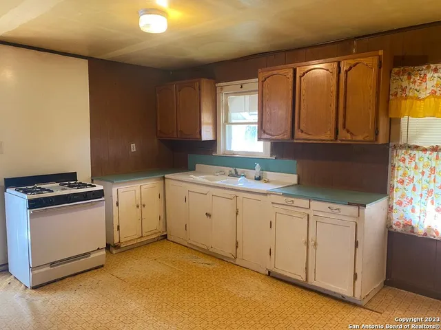 a bathroom with a toilet and shower