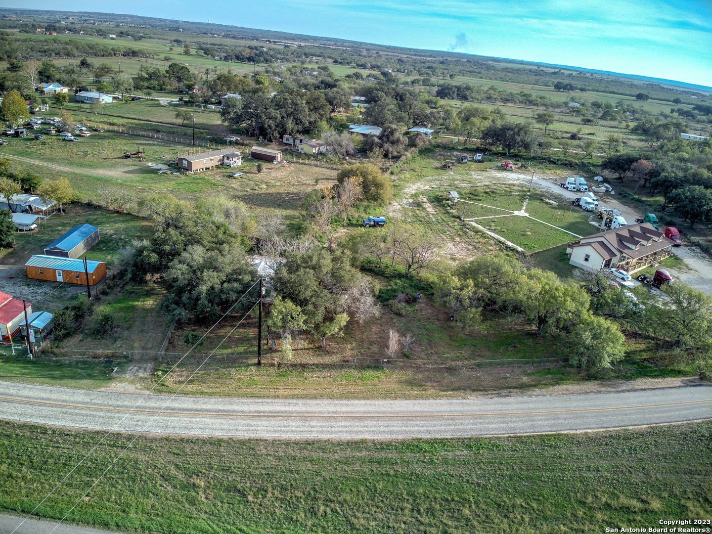 17770 Interstate 35 Lytle, TX 78052 - Photo 29 of 32 an aerial view of residential houses with outdoor space and trees