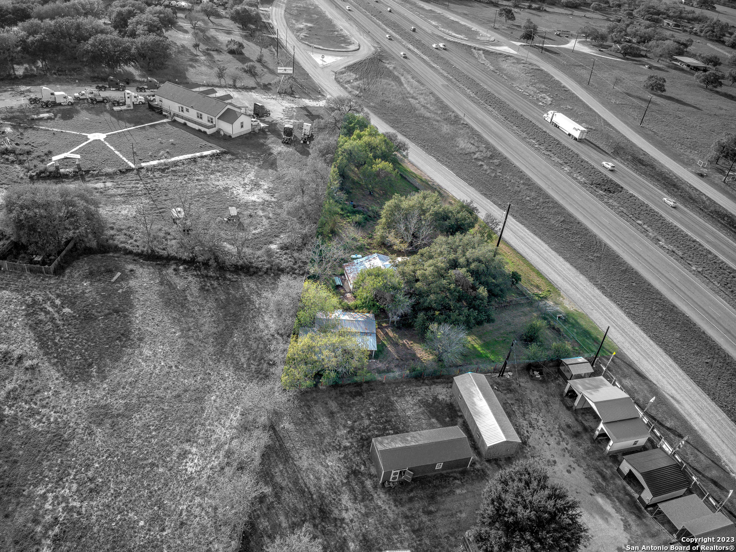 17770 Interstate 35 Lytle, TX 78052 - Photo 31 of 32 a view of a yard with plants and large trees