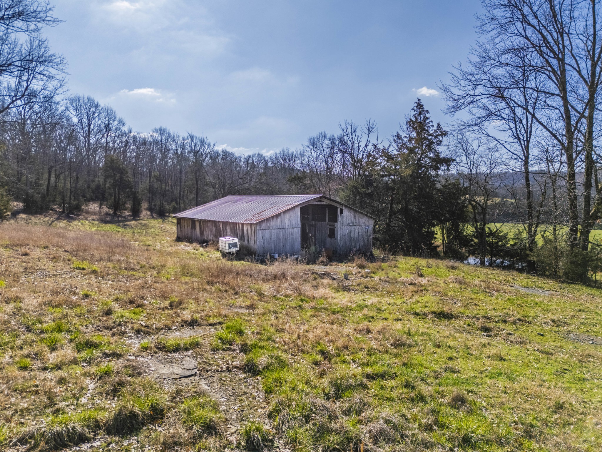 70 Gattistown Road Mulberry, TN 37359 - Photo 5 of 19 a view of a dry yard with wooden fence