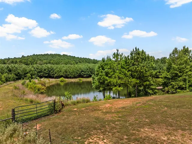 a view of a lake with a yard